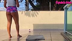 Brunette teases with shorts tucked up her curvy ass during outdoor training