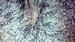 Man, this ebony babe plays with her hairy wet pussy in homemade solo until she orgasms hard.