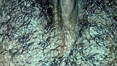 Man, this ebony babe plays with her hairy wet pussy in homemade solo until she orgasms hard.