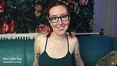 In this cuckold fantasy, a petite redhead with glasses, piercings, and tattoos dominates with dirty talk and humiliation in a goth femdom roleplay.