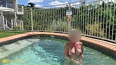 Hey, check out my wife flashing her big tits in the hotel pool during our daring public exhibitionist adventure.