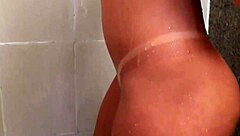 blonde brazilian teen explores her big ass while masturbating in the bath.