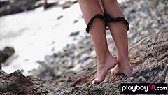 skinny canadian brunette kristie taylor teases in bikini on beach rocks with legs spread wide