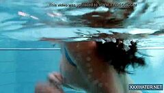 Hey there, check out this hot Hungarian teen 18+ named Petra chilling in the swimming pool with her tight, shaved body on display.