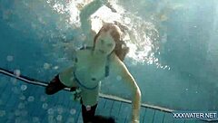 Hey there, check out this hot Hungarian teen 18+ named Petra chilling in the swimming pool with her tight, shaved body on display.