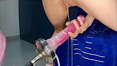 hey check out this petite babe squirting from a huge monster dildo on the fucking machine