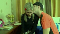 the beautiful blonde girl with big tits enjoys intimate moments on the bed. she wears fishnets lingerie and heels.