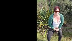 Narrative of trashy Kiwi milf pissing on roadside amid traffic in outdoor public scene