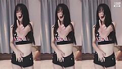 Watch out! This cute Chinese girl with big tits dances wildly, showing off her sexy slim body in an energetic routine.