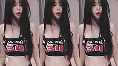 Watch out! This cute Chinese girl with big tits dances wildly, showing off her sexy slim body in an energetic routine.