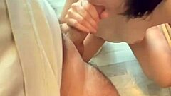 She sucks his cock and his balls while enjoying the warm cum on her skin