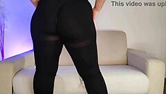 in a homemade setting a curvy brunette with long hair appears as an amateur wearing tight leggings