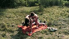 lesbian couple shares outdoor kiss then uses strapon for heated action