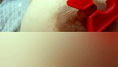 Gretala gently pinches her nipple in a moment of quiet self-exploration with big natural tits