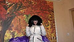 This milf slips into her down coat with fur hood and starts sucking that big dildo in all sorts of positions for homemade fetish fun