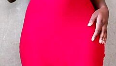 This sexy African lady teases by revealing her alluring tits