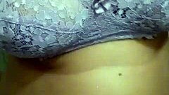 In a rural setting, the Indian milf from the village displayed her large chest during a video call.