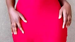 This sexy African lady teases by revealing her alluring tits