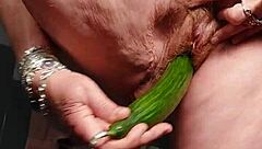 Granny fucks hairy pussy with cucumber deep