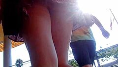A guy captures public upskirt footage in slow motion outdoors under her skirt.