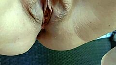 Mature squats spreads legs wide outdoors