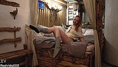 a pretty redhead slowly strips off her clothes then gently touches her smooth body all over