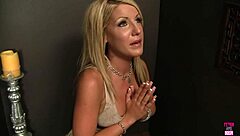 blonde holly lights up spotting that huge cock poke through the gloryhole