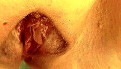 Blonde mature aunt spreads her huge shaved pussy lips wide open