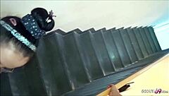 Skinny tattooed german milf mommy with glasses rims licks balls and takes facial cum on the stairs.