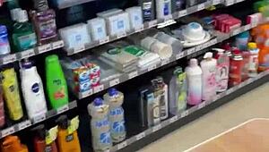 Asian Ladyboy Teases with Fresh Thong Display in Local Convenience Store Setting.