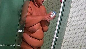 Hidden camera catches brazilian milf neighbor shaving her pussy