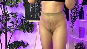 sexy milf putting on leather harness suit 😈